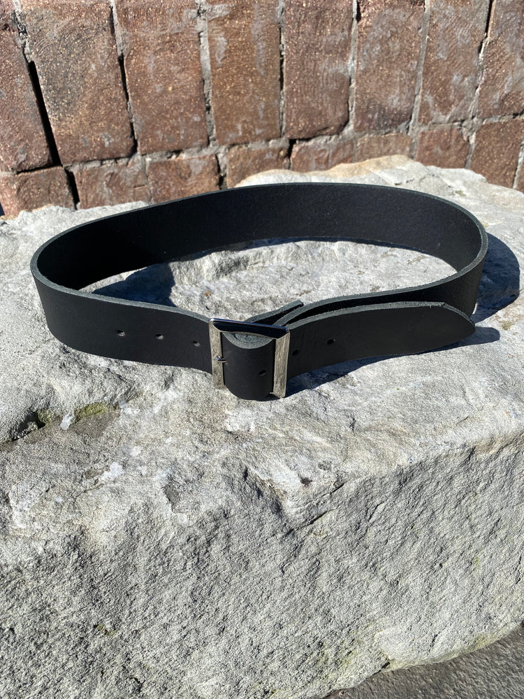 Black belt on a stone surface