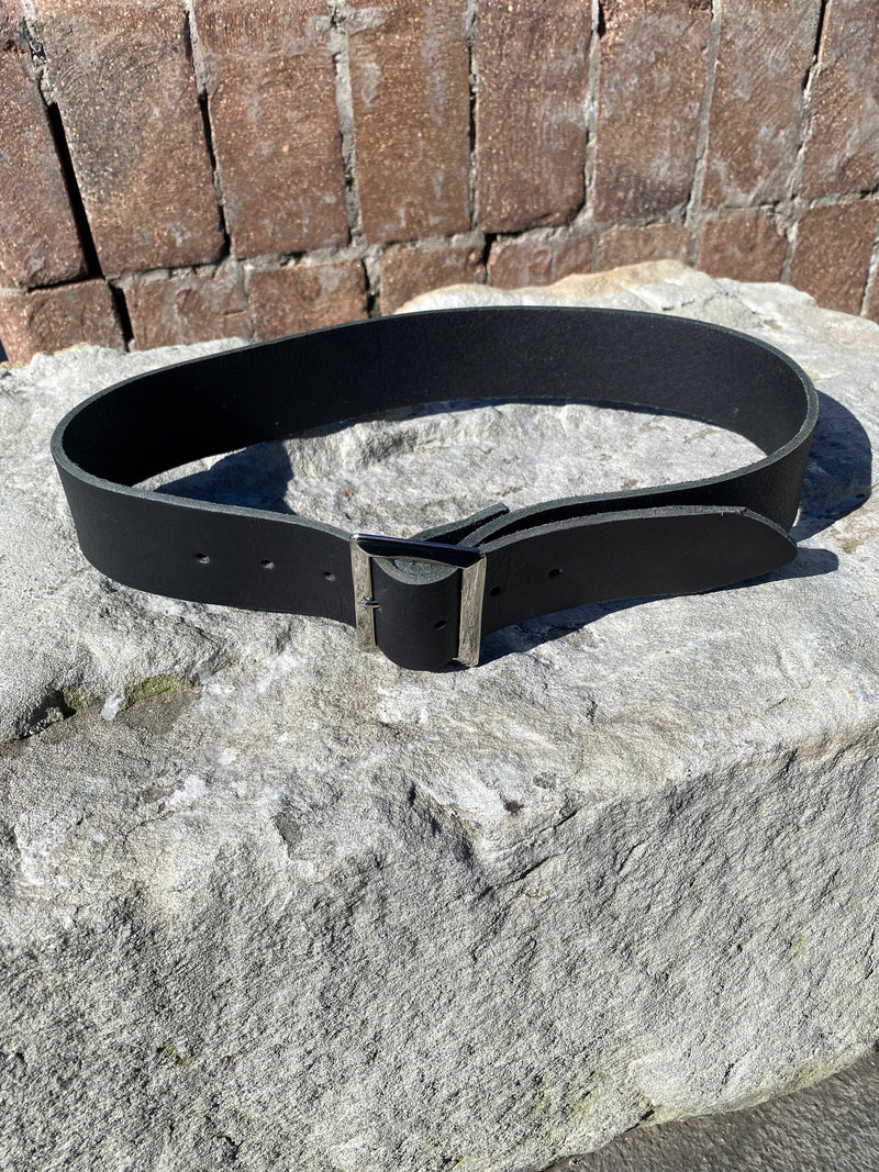 Black belt on a stone surface