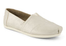 A women's Toms Alpargata slip-on shoe with a champagne metallic suede upper and a beige canvas footbed.