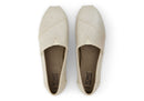 A women's Toms Alpargata slip-on shoe with a champagne metallic suede upper and a beige canvas footbed.