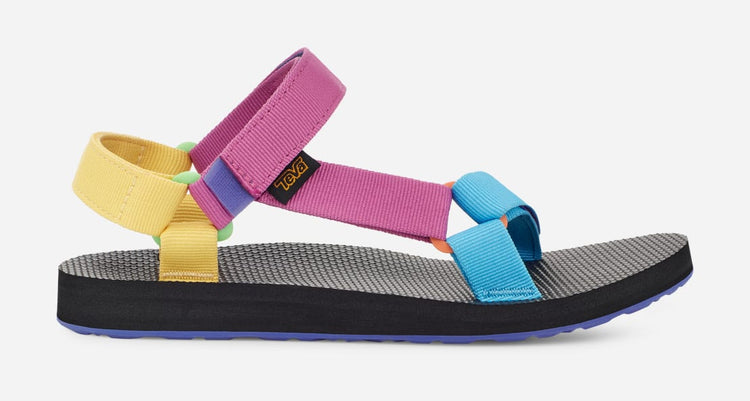 A colorful Teva women's sandal with multiple straps in blue, pink, yellow, and black, featuring a black rubber outsole and a molded EVA midsole with heel cupping.