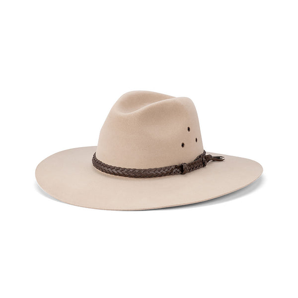 Beige cowboy hat with a braided brown band on a white background