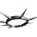 A black leather spiked collar with multiple metallic silver and bronze-toned spikes, photographed on a gray tiled floor.