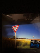 Album cover with 'Give Way' sign and field, featuring Pearl Jam branding.