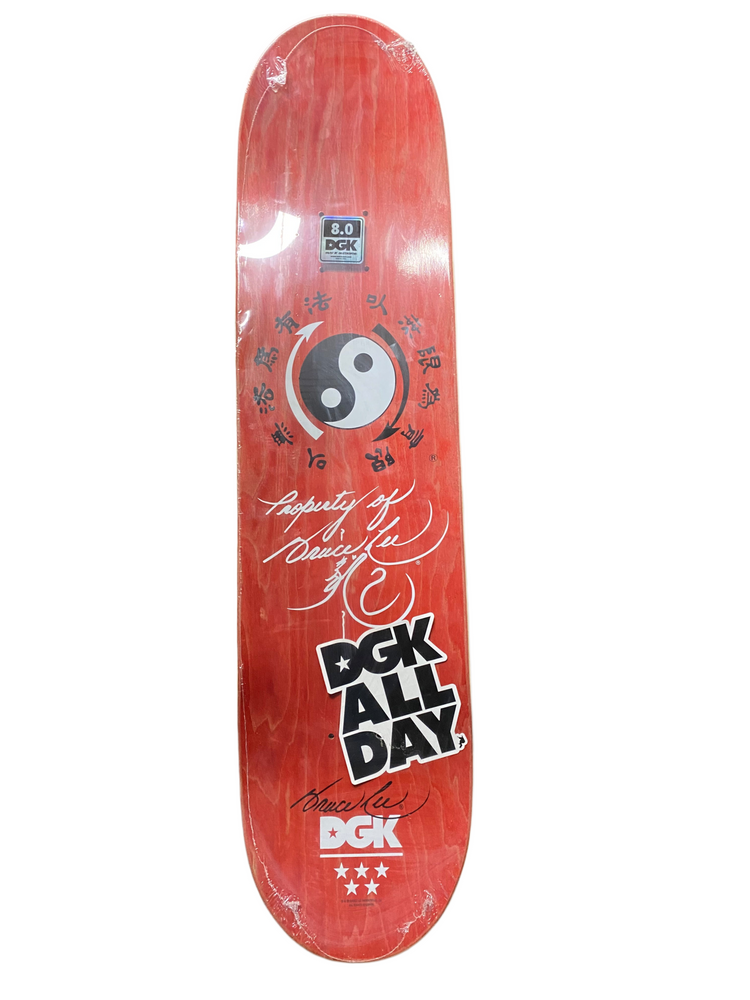 Red DGK skateboard deck with black and white graphics on a white background
