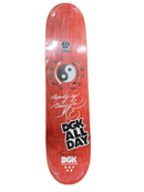 Red DGK skateboard deck with black and white graphics on a white background