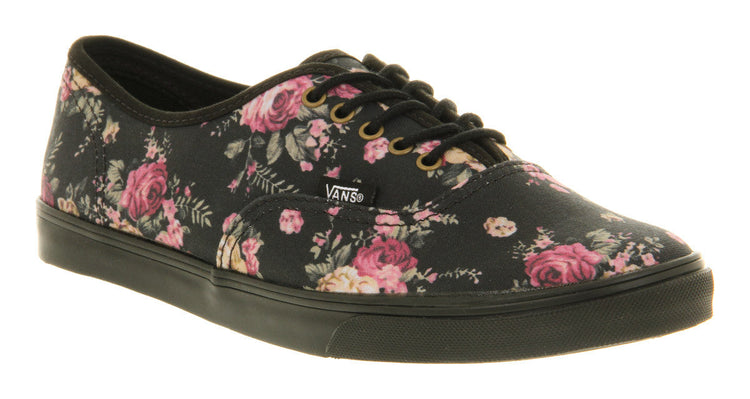 Black sneaker with floral pattern on a white background