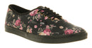 Black sneaker with floral pattern on a white background