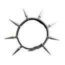 A black leather spiked collar with multiple silver metal spikes, laid flat on a gray asphalt surface.