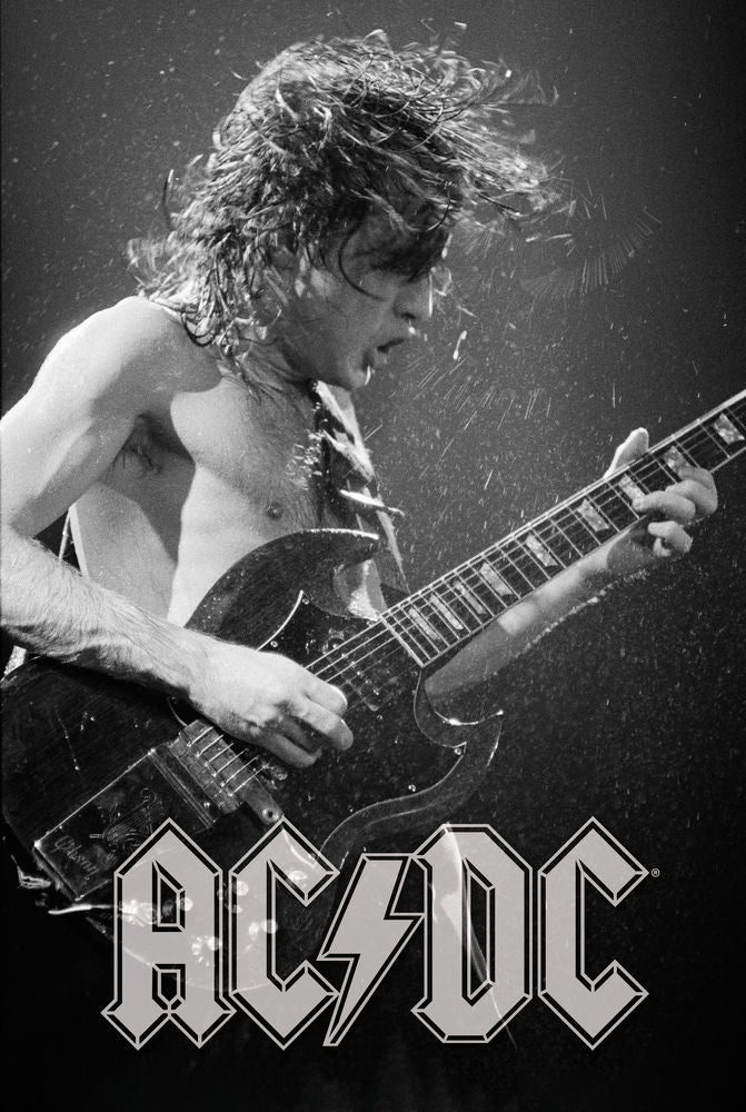 Black and white photo of a guitar player with AC/DC logo