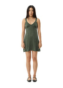 Woman wearing a green dress on a white background