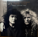 A vinyl record album for David Gilmour & Jimmy Page's 'Toko Volume Two' resting on a wooden floor. The cover features a black and white photograph of the two musicians.