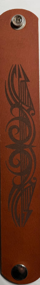 leather  Wristband with a metallic clasp and engraved design