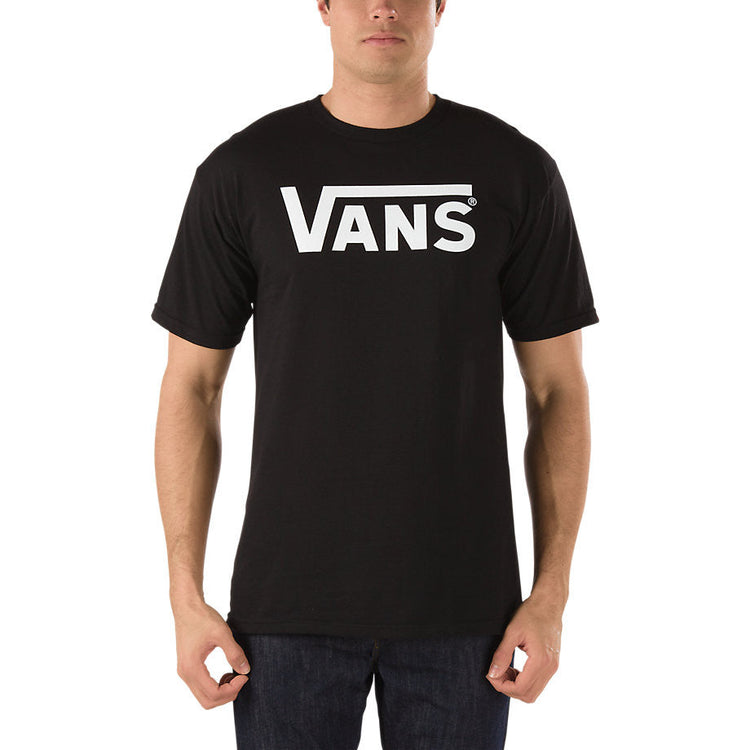 Person wearing a black Vans t-shirt on a white background