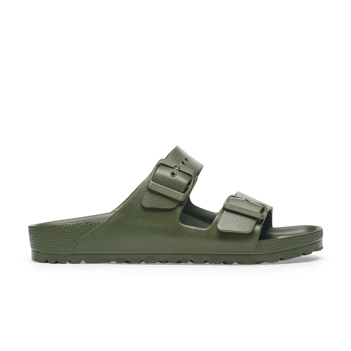 Green sandal with double buckle on a white background