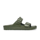 Green sandal with double buckle on a white background