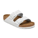 White sandal with cork sole on a white background