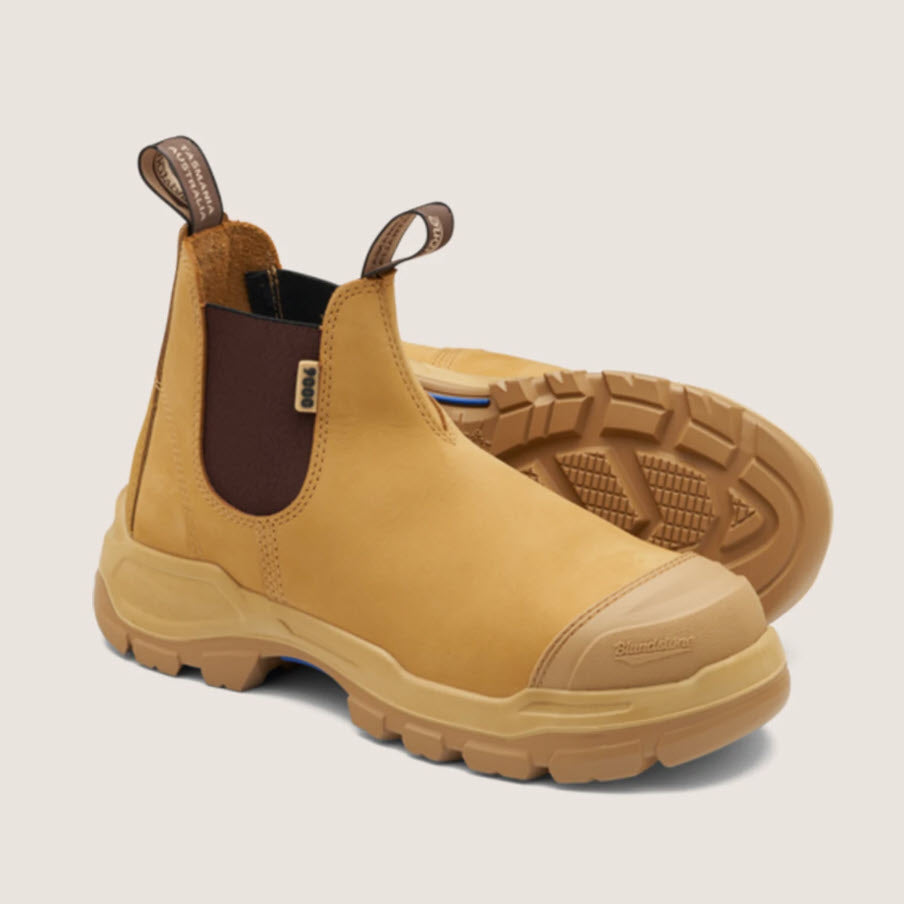 A pair of Blundstone 9000 Unisex RotoFlex Safety Boots in wheat color with elastic-sided design, steel toe cap, and rubber outsole.