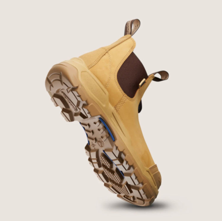 A pair of Blundstone 9000 Unisex RotoFlex Safety Boots in wheat color with elastic-sided design, steel toe cap, and rubber outsole.