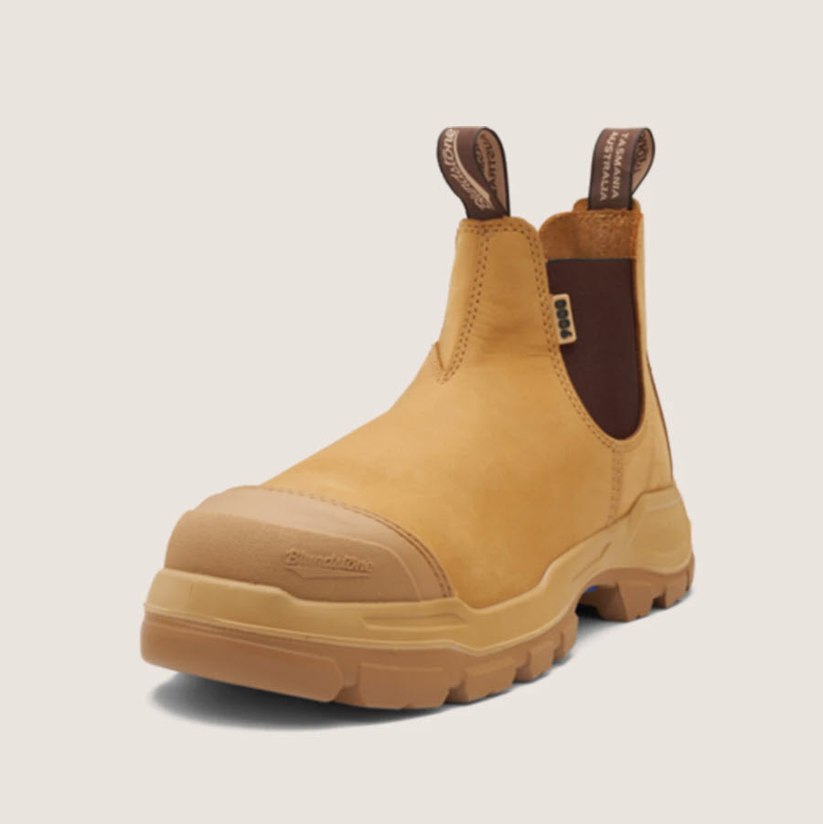 A pair of Blundstone 9000 Unisex RotoFlex Safety Boots in wheat color with elastic-sided design, steel toe cap, and rubber outsole.