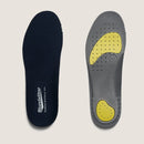 Two shoe insoles, one black and one gray with yellow accents, on a light beige background.