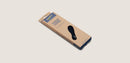 Black shoe insole with yellow accents on a beige background, featuring Blundstone brand.