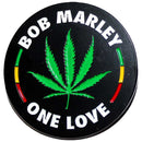 Circular sticker with Bob Marley 'One Love' text and green cannabis leaf on a black background