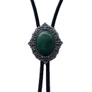Bolo tie with green stone and silver metal on a white background