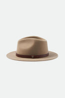 Beige fedora hat with a brown band on a white background