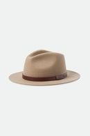 Beige fedora hat with a brown band on a white background
