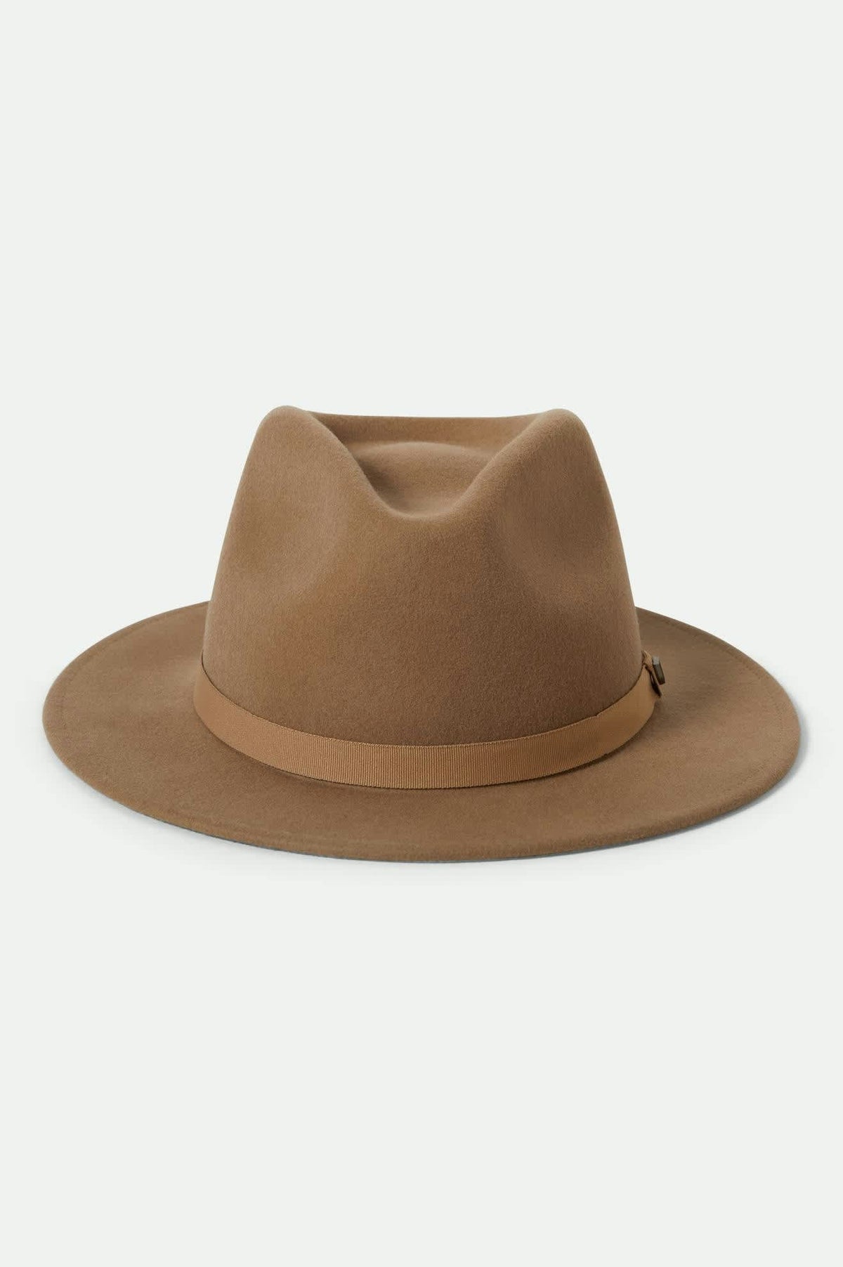 Brown fedora hat with band on a light beige background