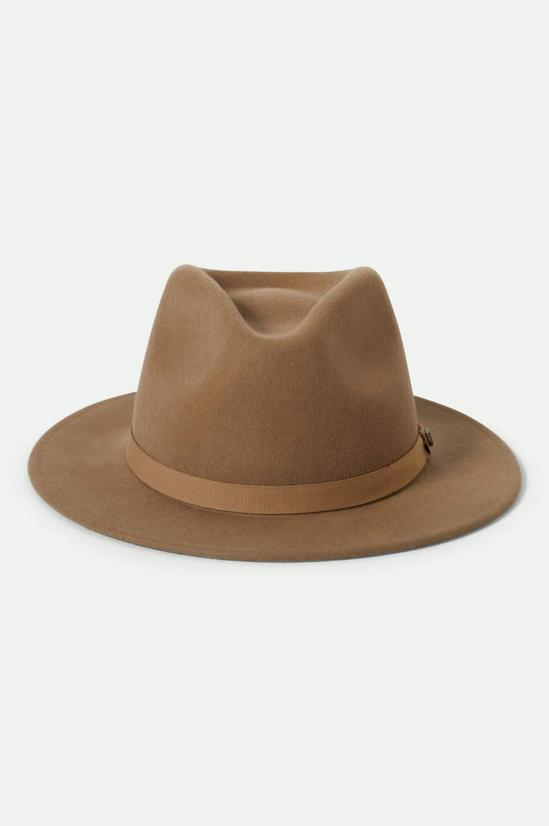 Brown fedora hat with band on a light beige background