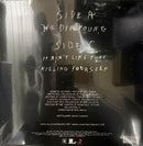 The back cover of a vinyl record for the album 'Side A: We Die Young Side C: It Ain't Like That Killing Yourself' by Pat Methacoli, shown inside its protective plastic shrink-wrap with reflections and dust specks visible.