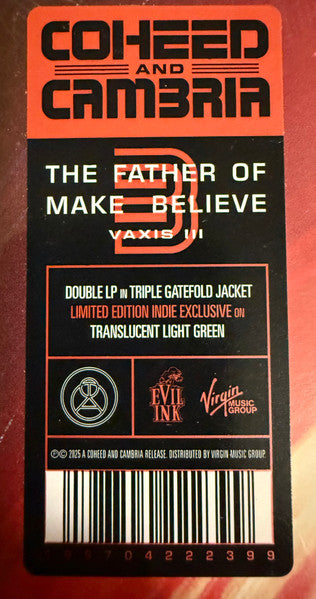 A close-up of a Coheed and Cambria 'The Father of Make Believe Vaxis III' double LP in a triple gatefold jacket, showing the front cover art with orange, black, and white text and logos.