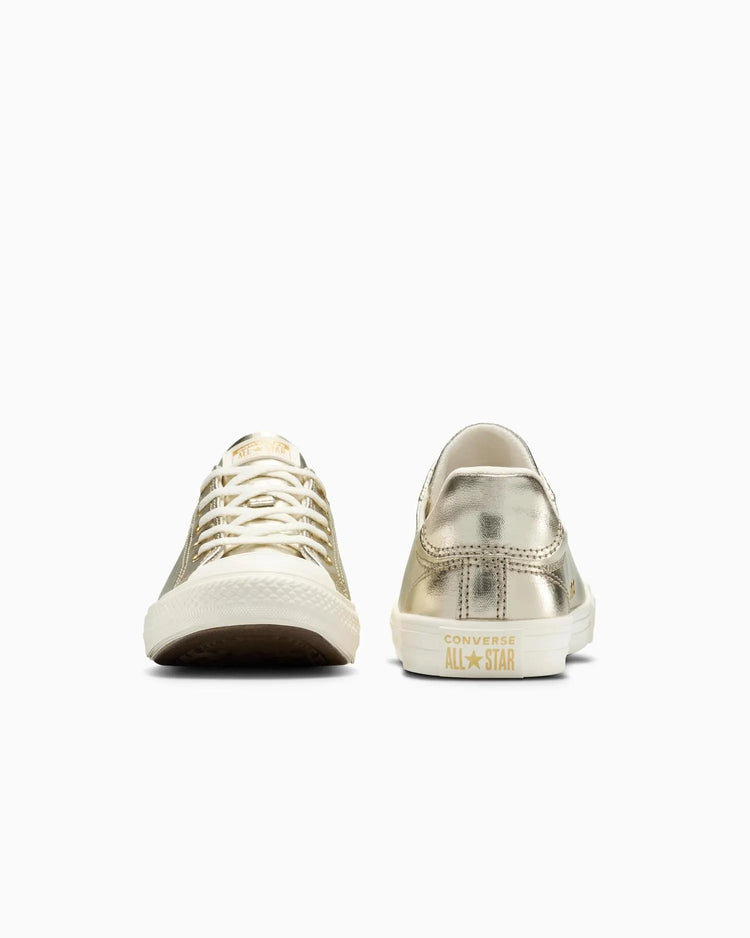 Pair of white sneakers with 'Converse All Star' branding on a white background