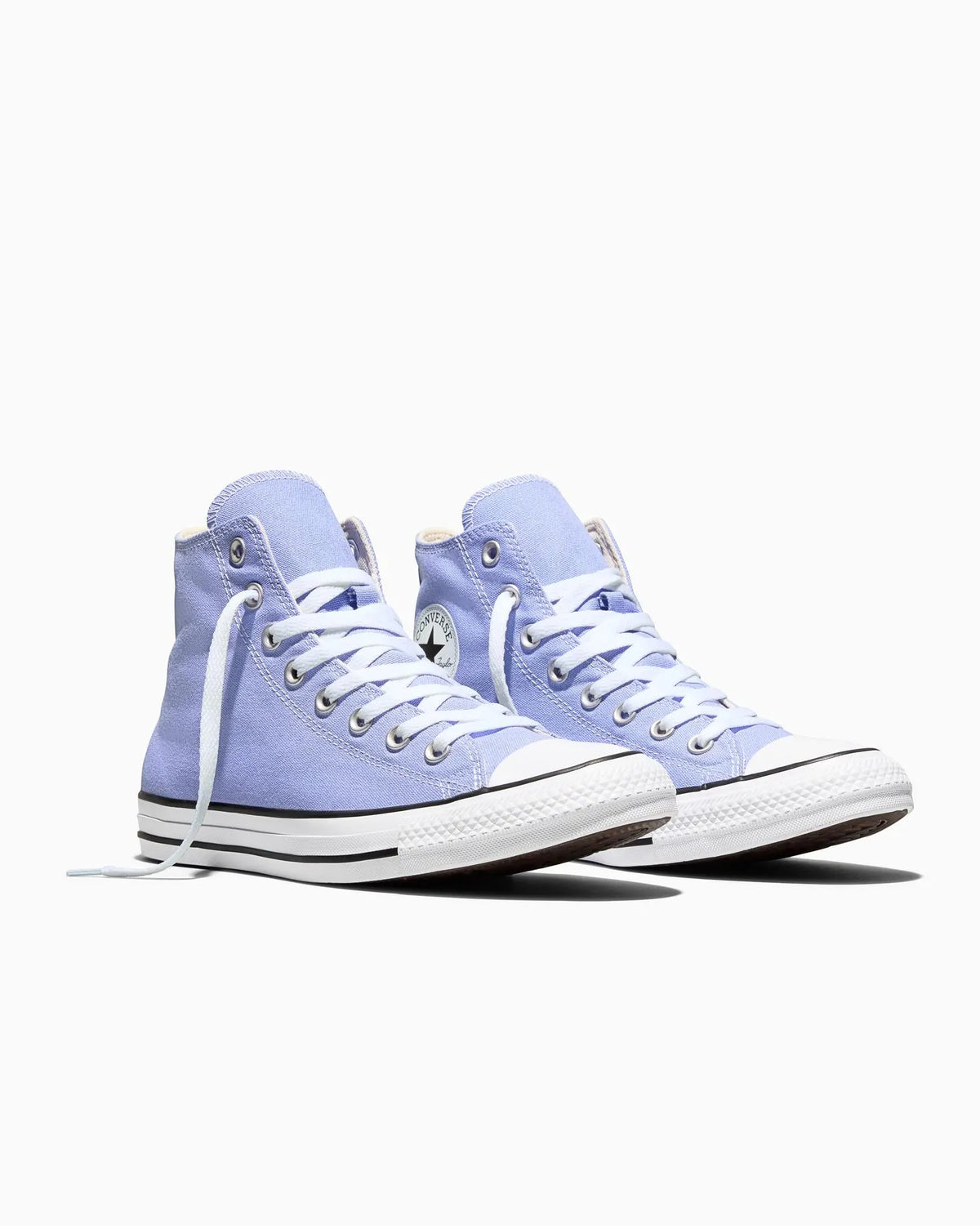 Pair of light blue high-top Converse sneakers on a white background