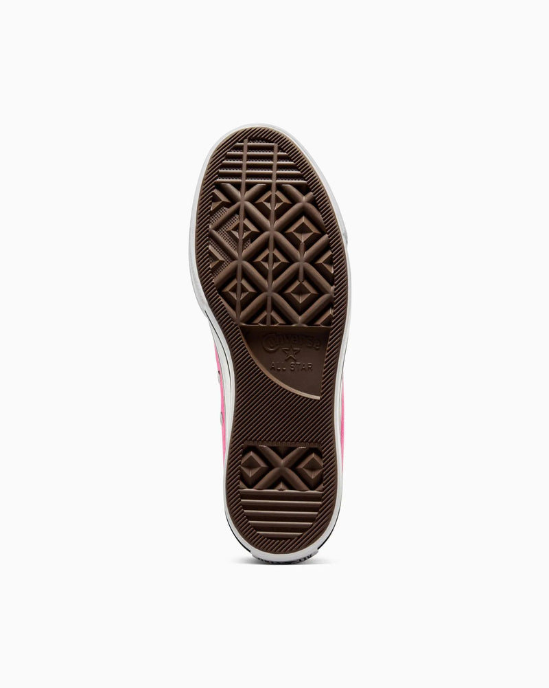 Close-up of a shoe sole with a geometric pattern on a white background