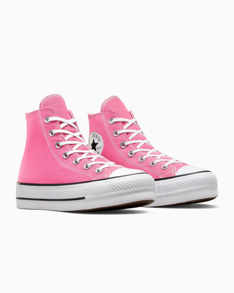 Pink high-top sneakers with white laces on a white background