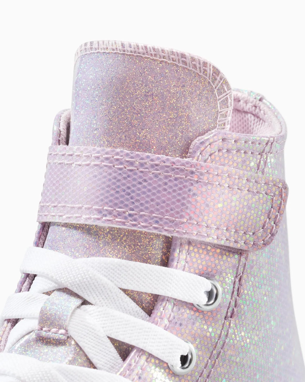 Close-up of a pink Converse high-top sneaker with white laces on a white background