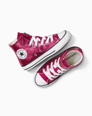 Pink Converse sneakers with white laces on a white background