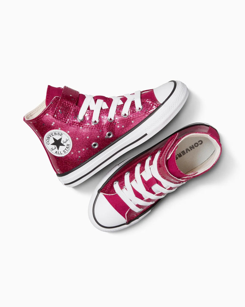 Pink Converse sneakers with white laces on a white background