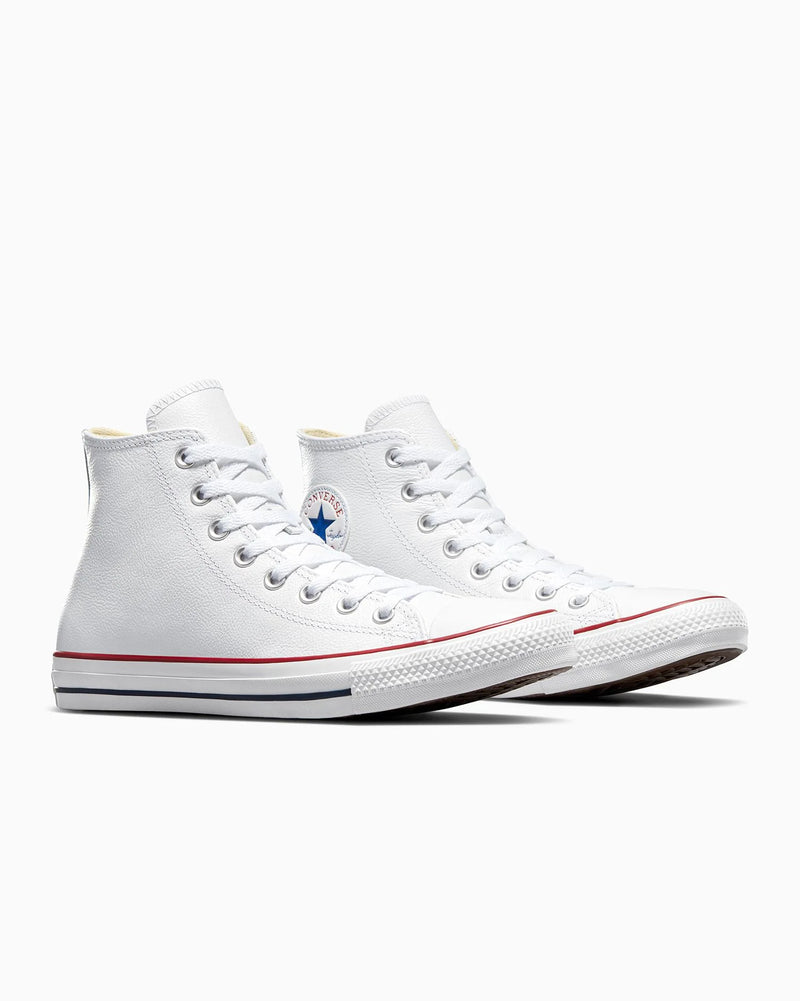 White high-top sneakers with red accents on a white background