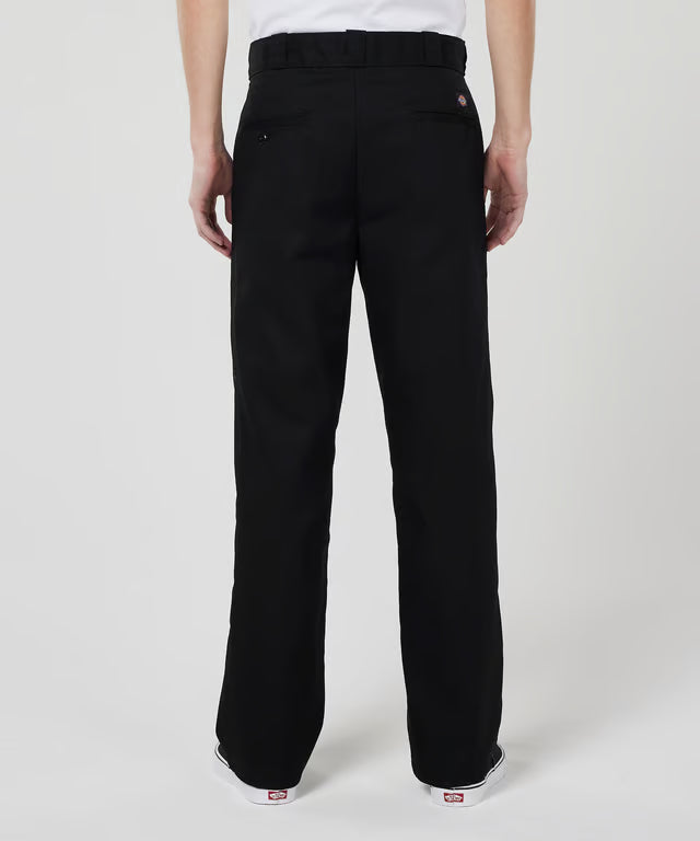 Black Dickies pants worn by a person on a white background