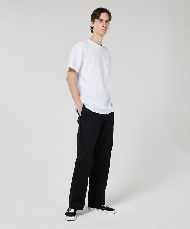 Black Dickies pants worn by a person on a white background