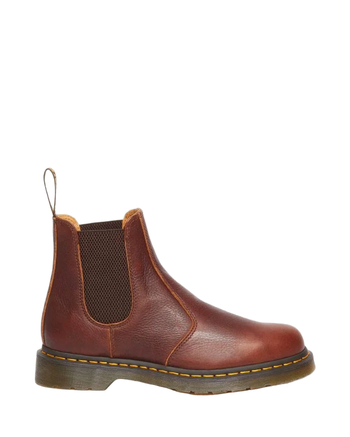Brown leather Chelsea boot on a light gray background