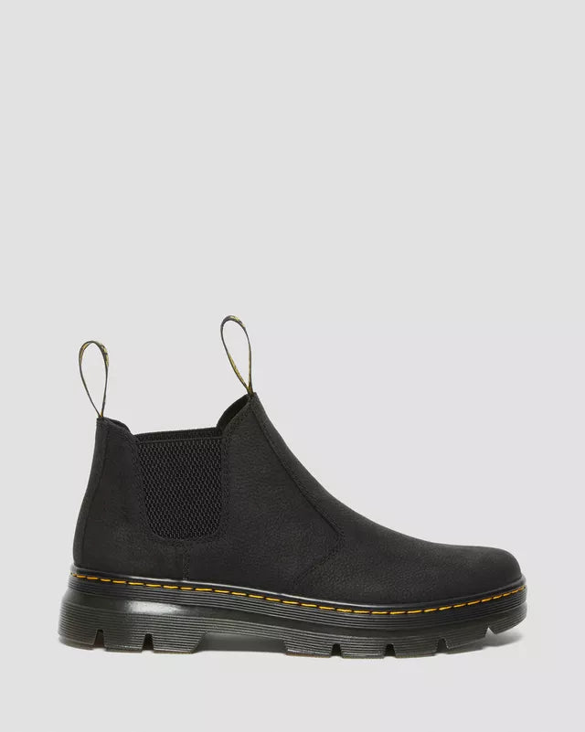 Black Chelsea boot on a light gray background
