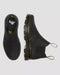 Black Dr. Martens Boots on a light gray background