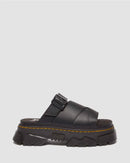 Black sandal with a thick sole on a light gray background