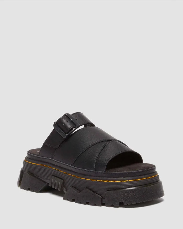Black sandal with a thick sole on a light gray background