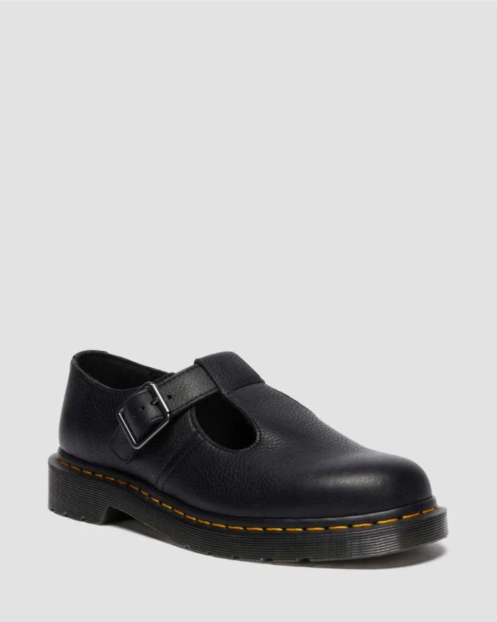 Black leather shoe with a strap on a light gray background